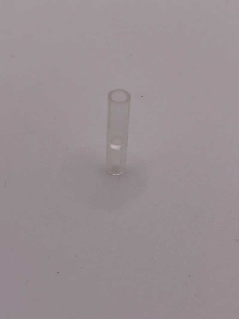 Connector: pipe, small 3 studs long in Clear (Translucent)