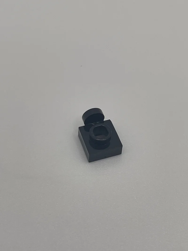 Plate 1 x 1 with one stud on side, ascending in Black