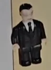 Figure, AA: Agent, black suit & tie, dark hair