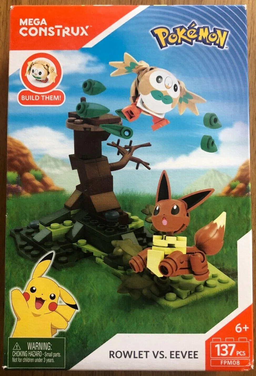 Original packaging for FPM08 Rowlet vs. Eevee