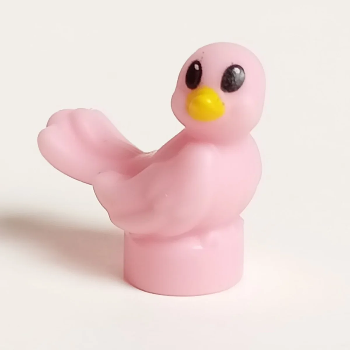 bird, looking to the right, black eyes, yellow beak pattern in Pink, Pale