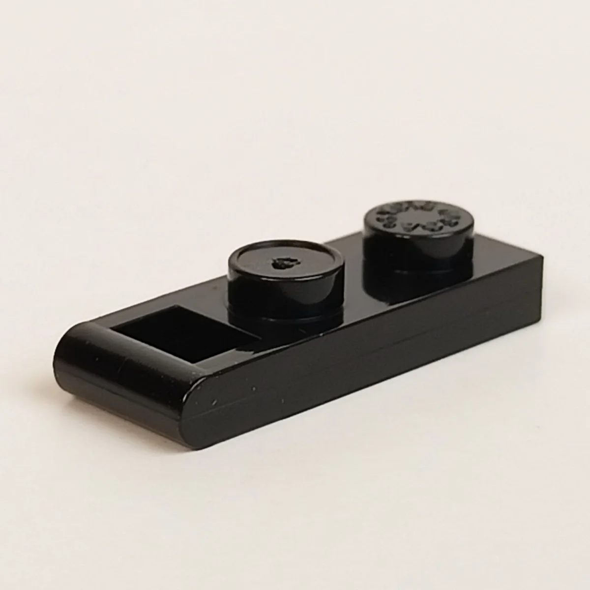 Plate Modified 1 x 2 with offset handle, type 01 in Black