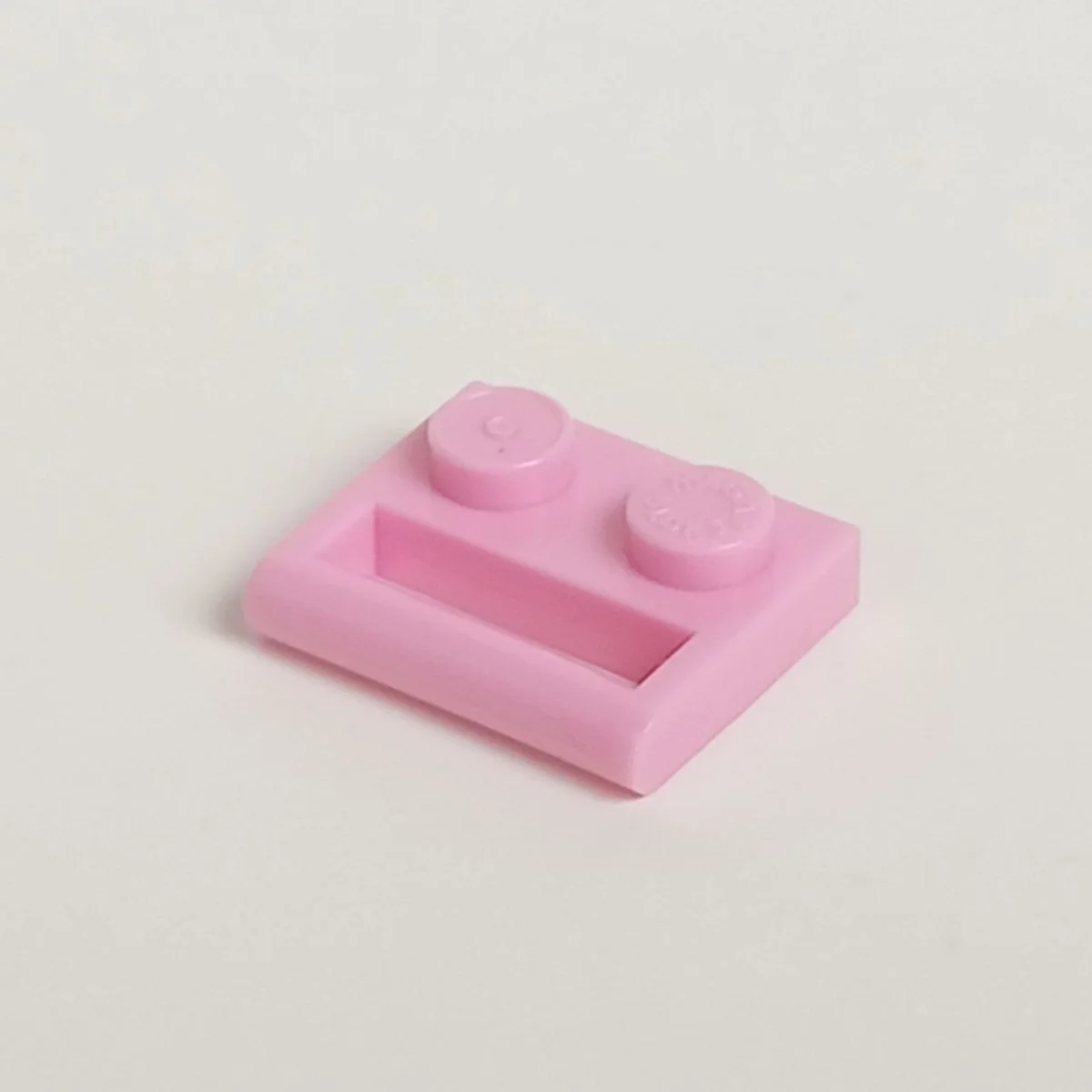 Plate Modified 1 x 2 with enclosed handle, lengthwise in Pink, Rose
