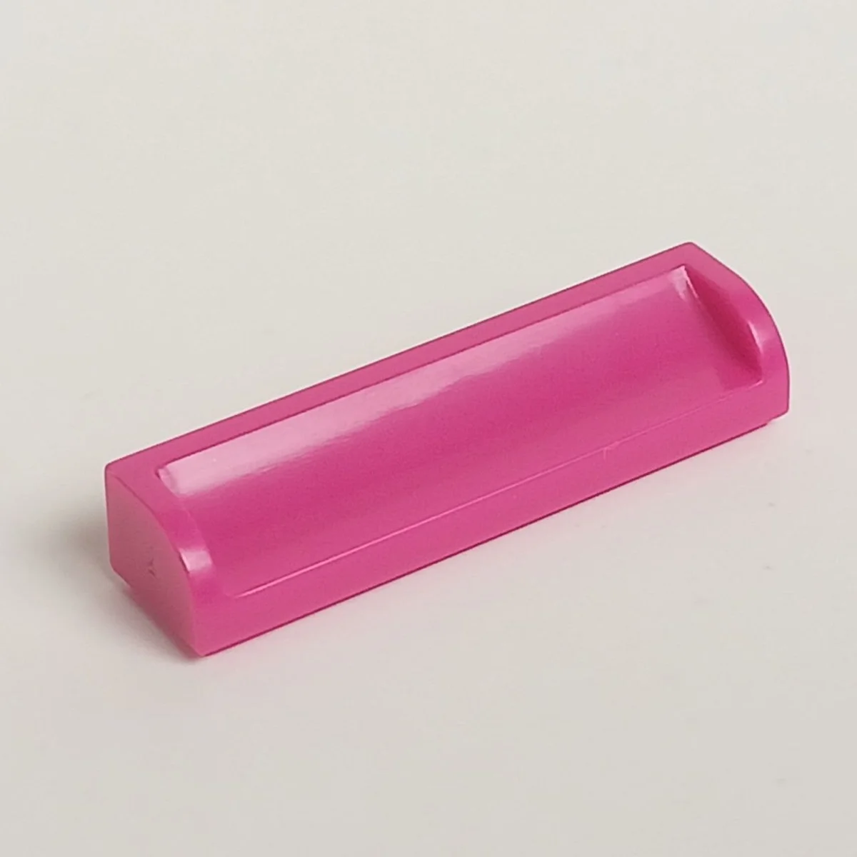 Slope panel 4 x 1 with concave slope and raised edges in Pink, Barbie
