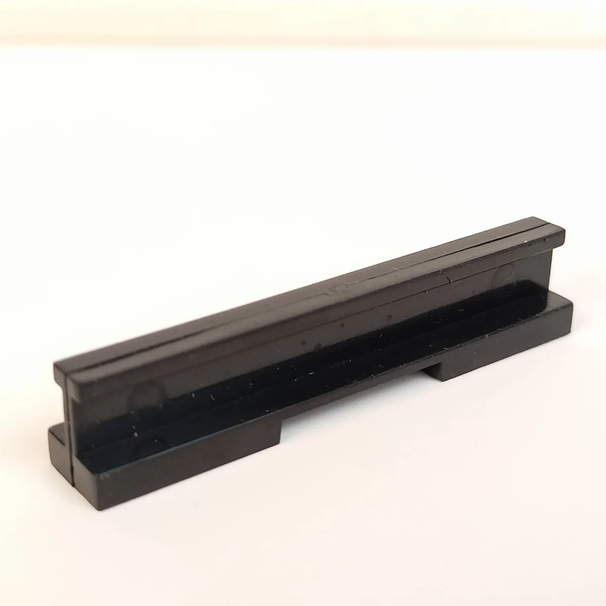 Brick 1 x 6 rail in Black