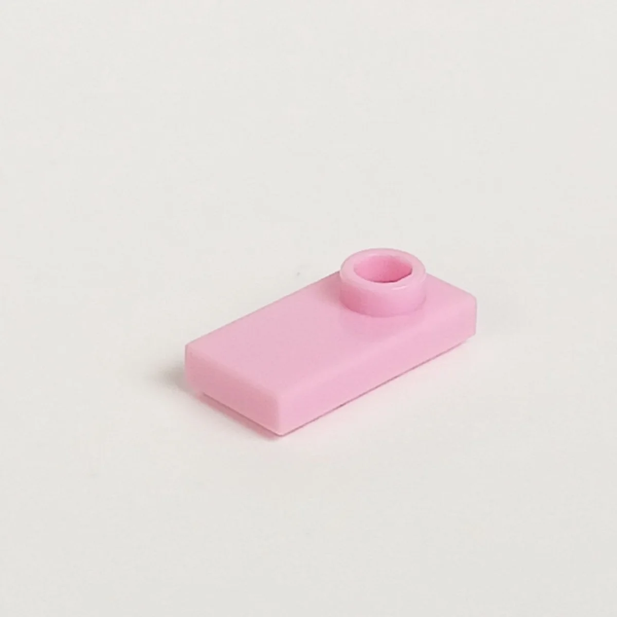 Plate Modified 1 x 2 with one stud, offset in Pink, Rose