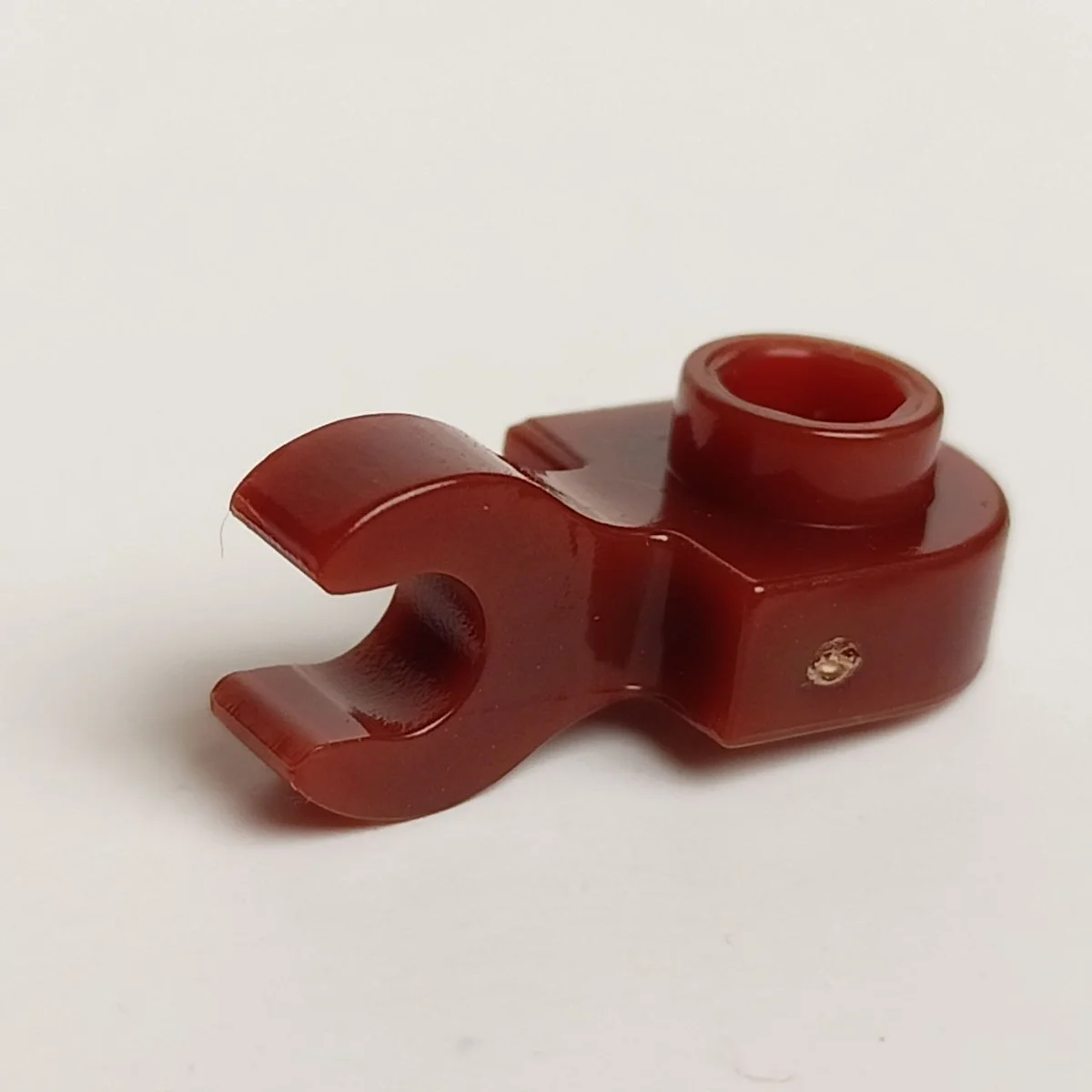 Plate 1 x 1 half-round with horizontal clip in Brown