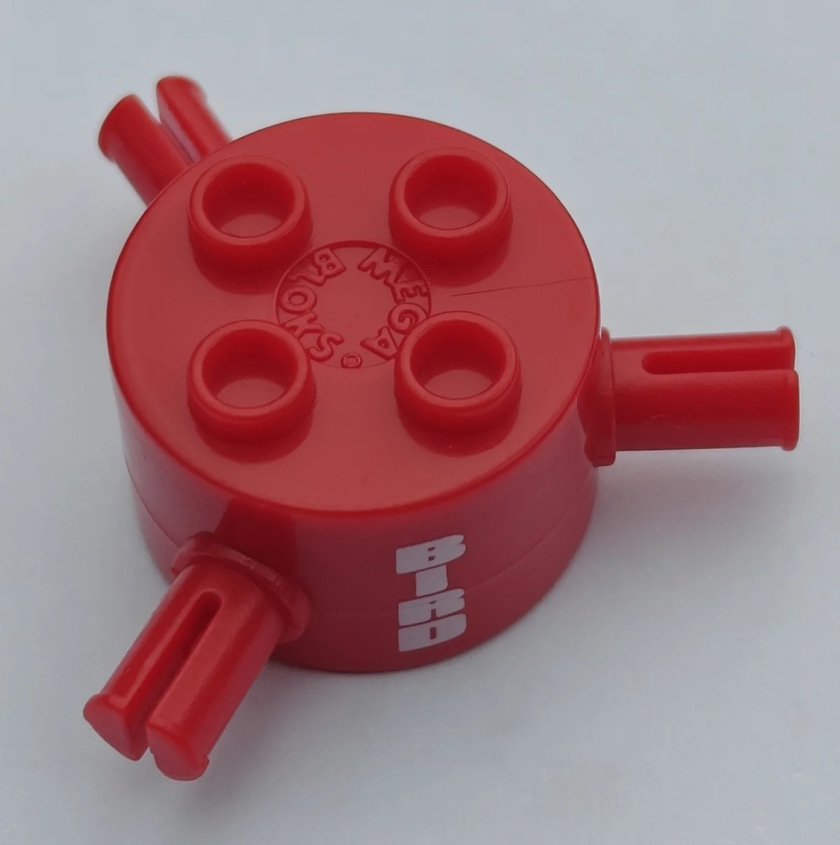 Cylinder 2 x 2 1/3 x 2 with radial axle pins, printed with ''BIRD''