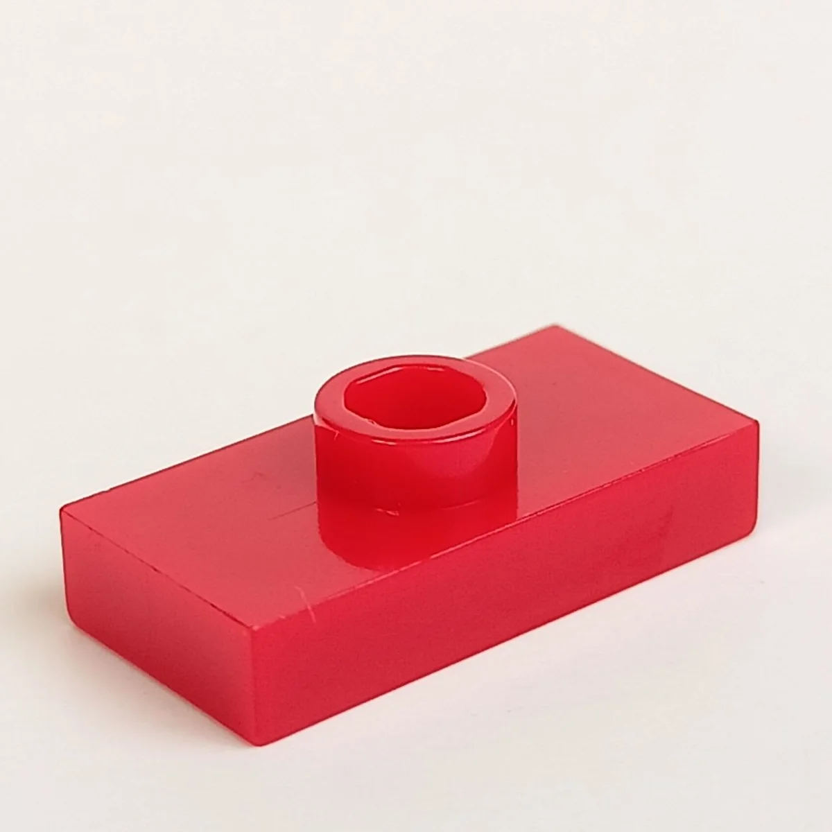Plate Modified 1 x 2 with one stud, centered in Red, Flame