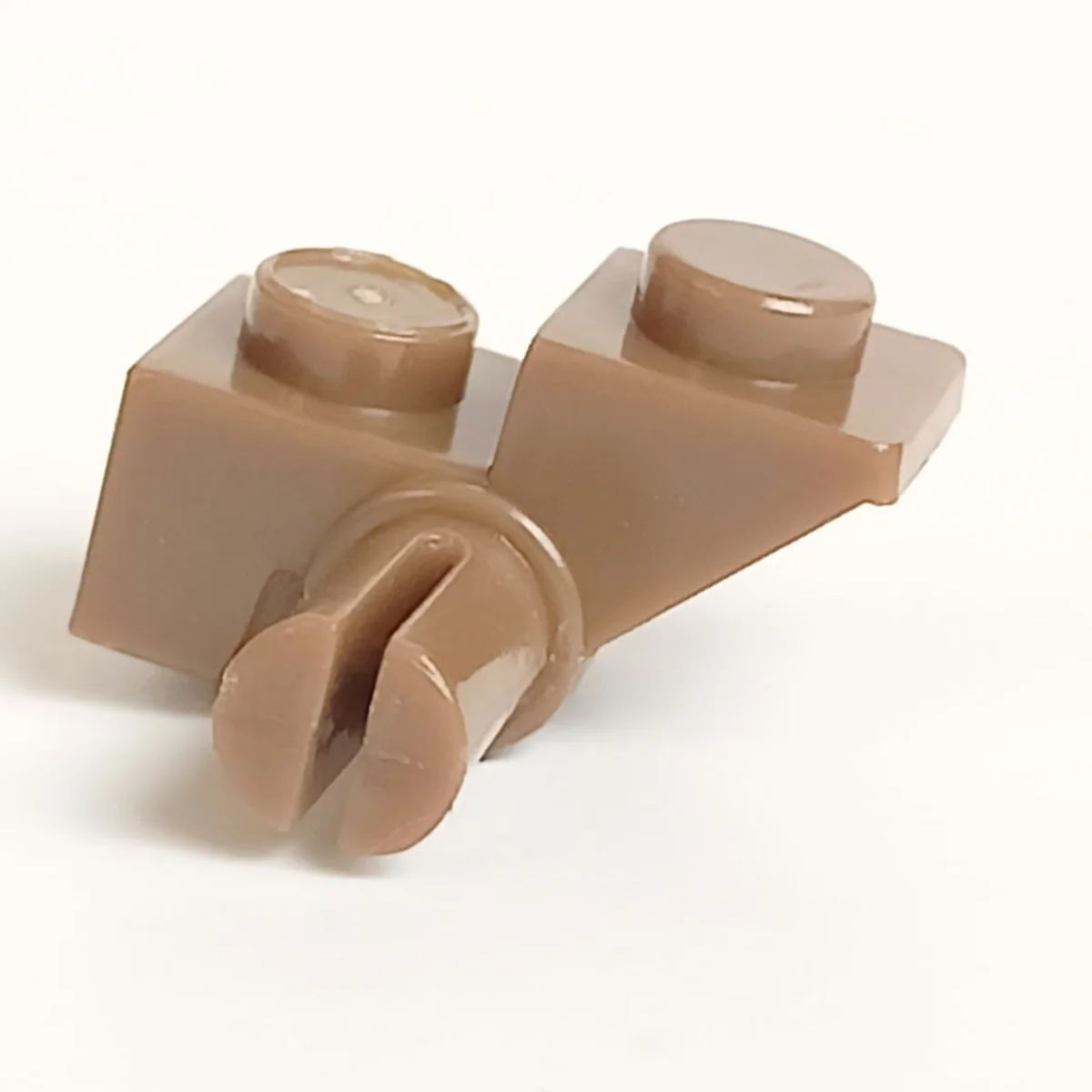 Slope brick 45 1 x 2 inverse with axle, right in Brown, Milk Chocolate