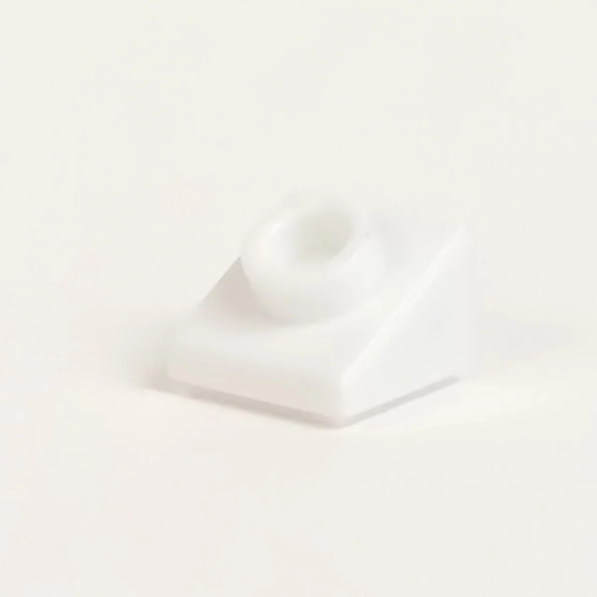 Slope brick 25 1 x 1 with open stud on slope in White