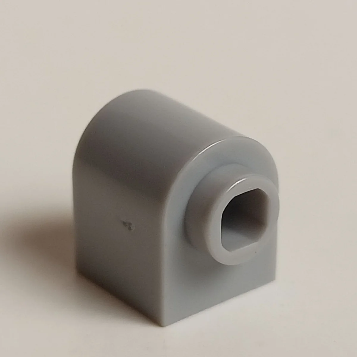 Brick 1 x 1 with rounded top and side stud in Gray, Dull
