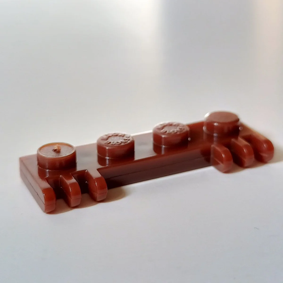 Hinge plate 1 x 4 with 2 pairs of 3 fingers in Brown, Reddish