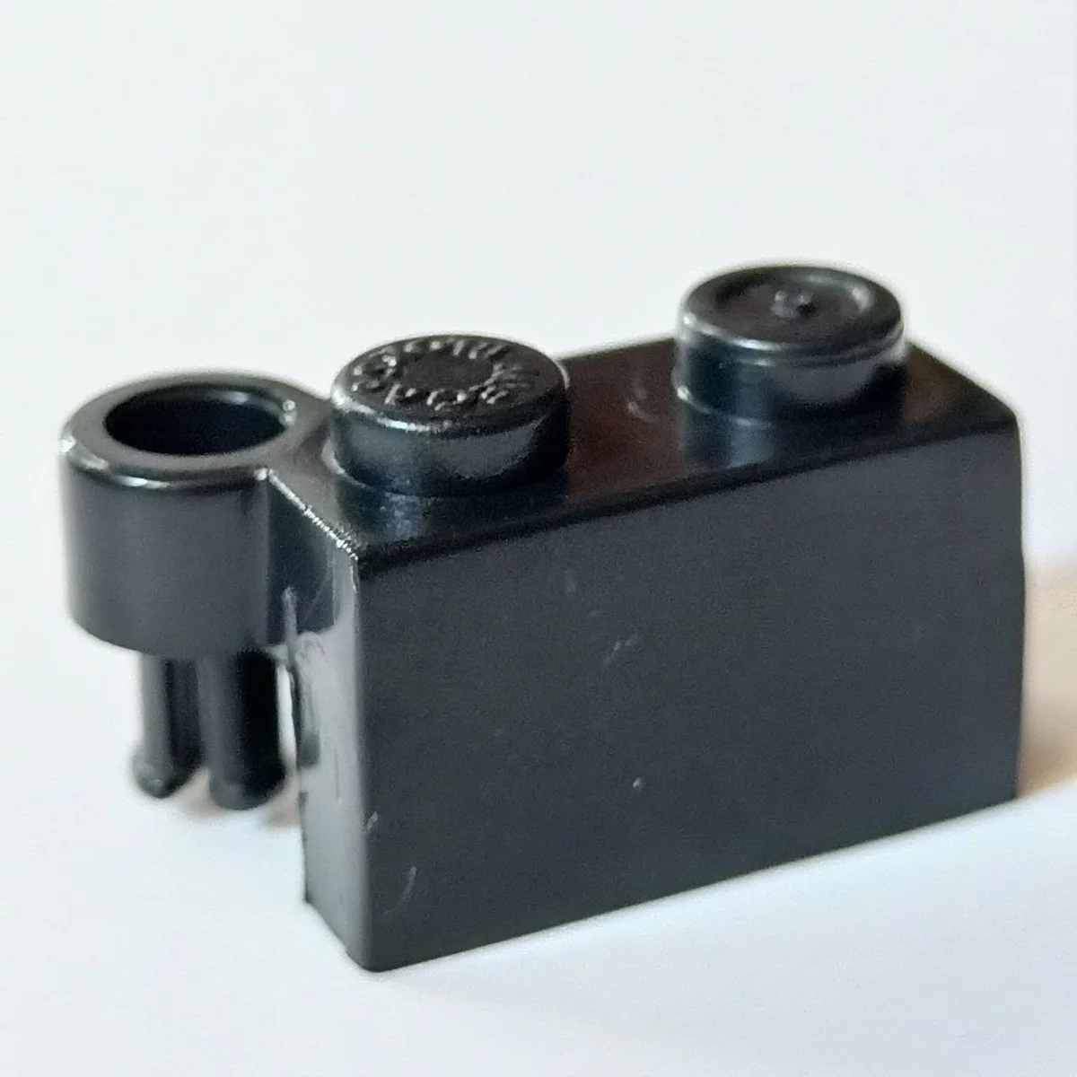 Hinge brick 1 x 4, top in Black