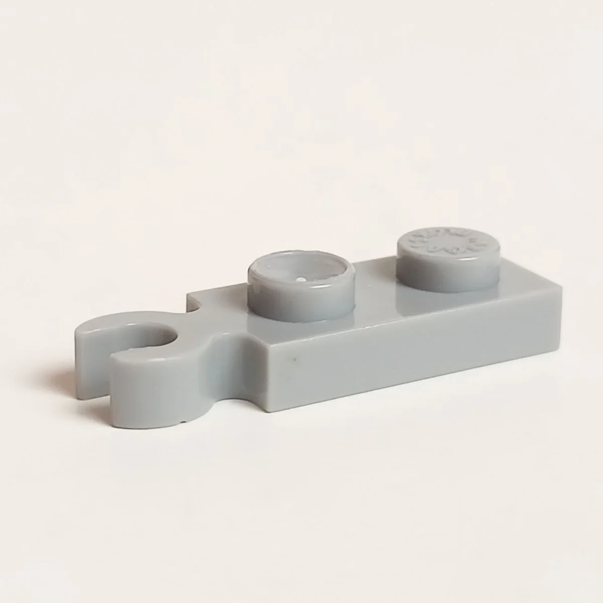 Plate Modified 1 x 2 with vertical clip on end in Gray, Dull