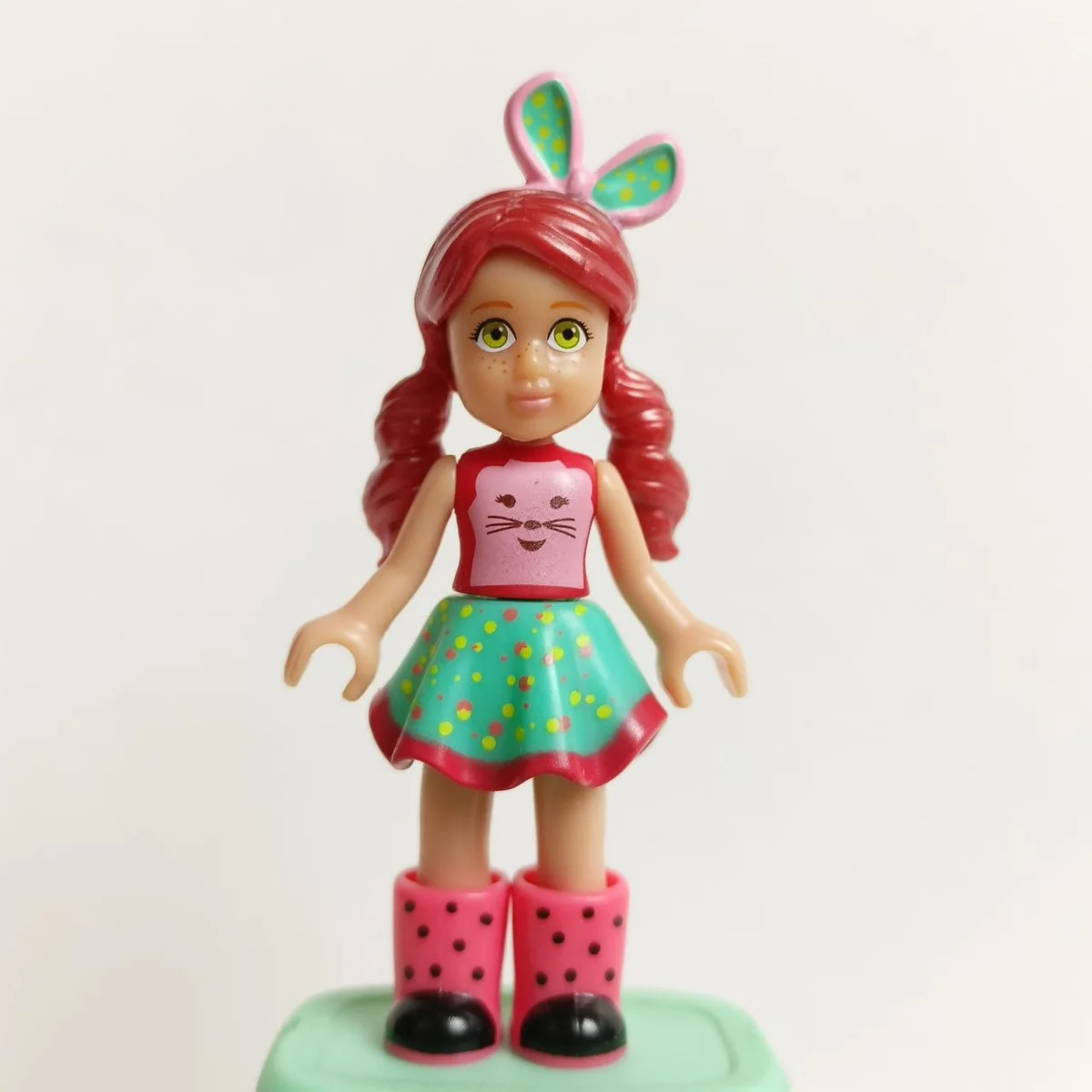 Willa, red shirt, turquoise skirt, coral wellington boots, light pink large bow tie