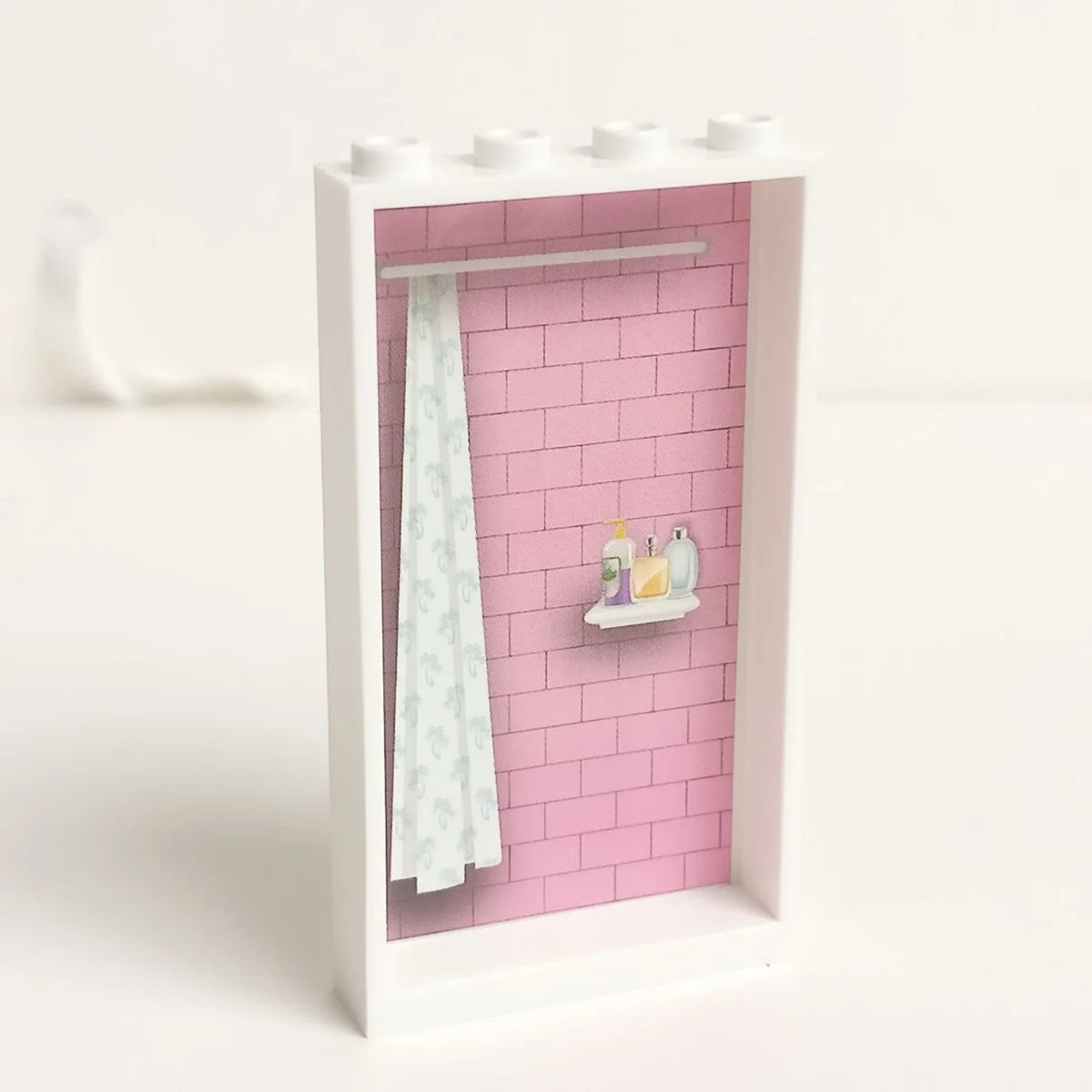 Wall 4 x 6 x 1 with stickered on window with birds on a hanging birdhouse and plants on a ledger on one side and shower courtains with pink brick wall and shampoos on the other in White