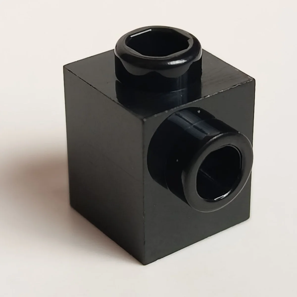 Brick 1 x 1 with side stud in Black
