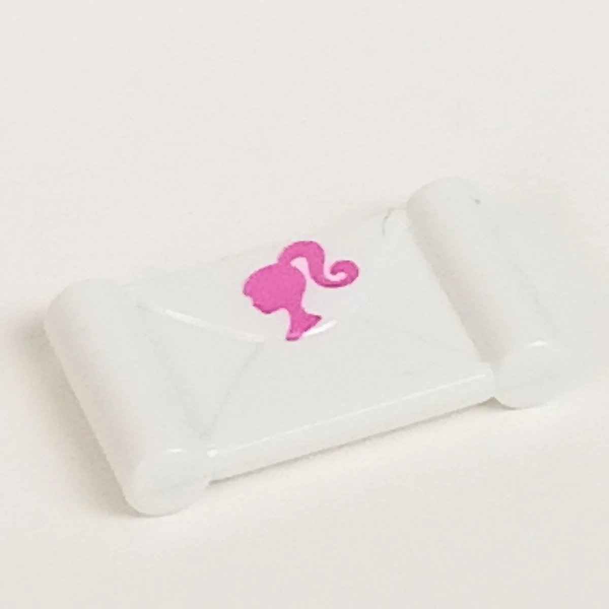 letter with handlebars, barbie pink barbie head in White