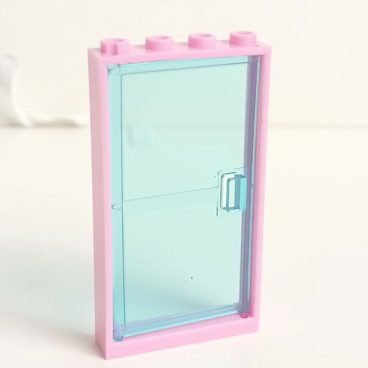Door 1 x 6 x 4 assembly (Pink, rose frame and translucent blue, medium door) in Multicolored