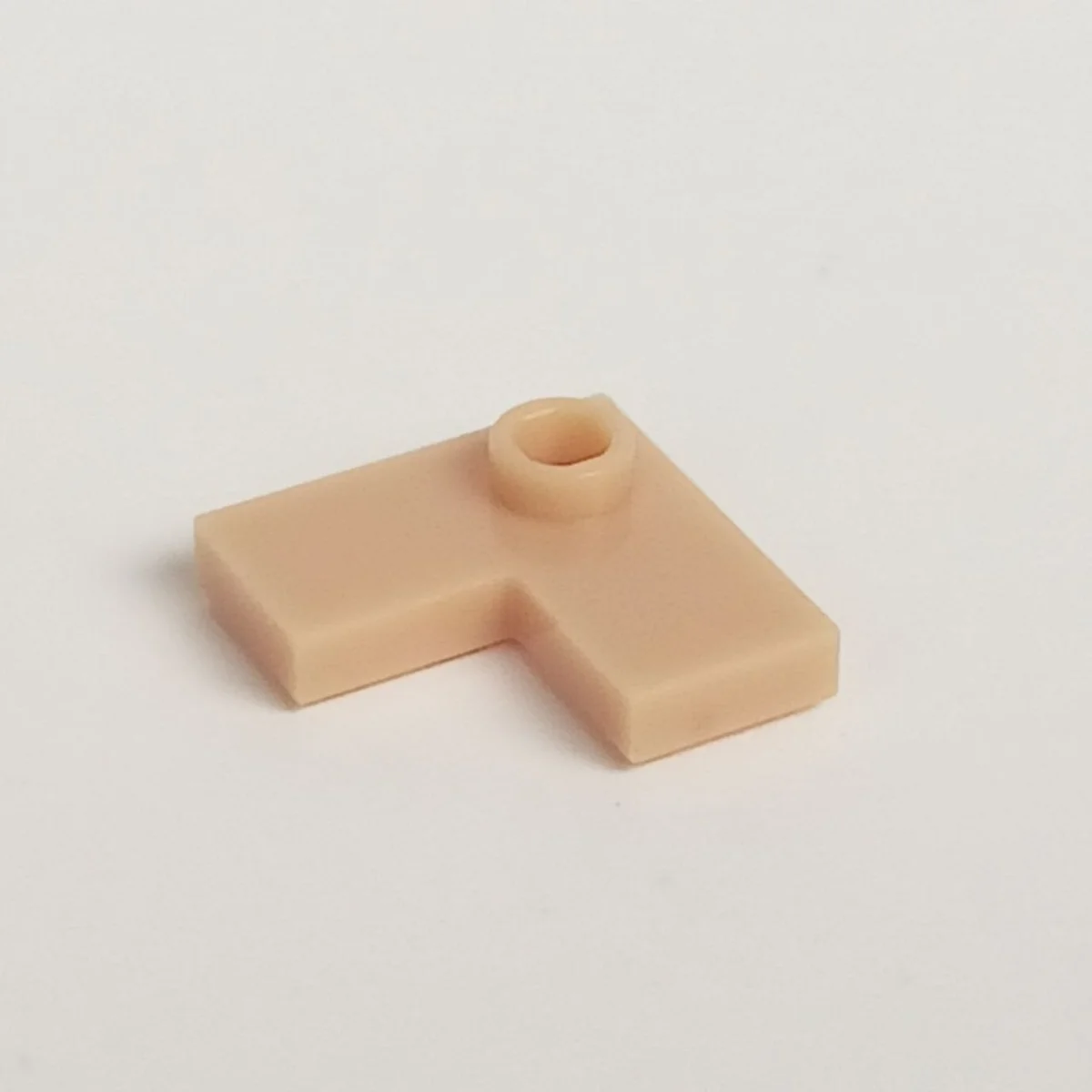 Plate 2 x 2 corner with one stud, center in Brown, Light Tan