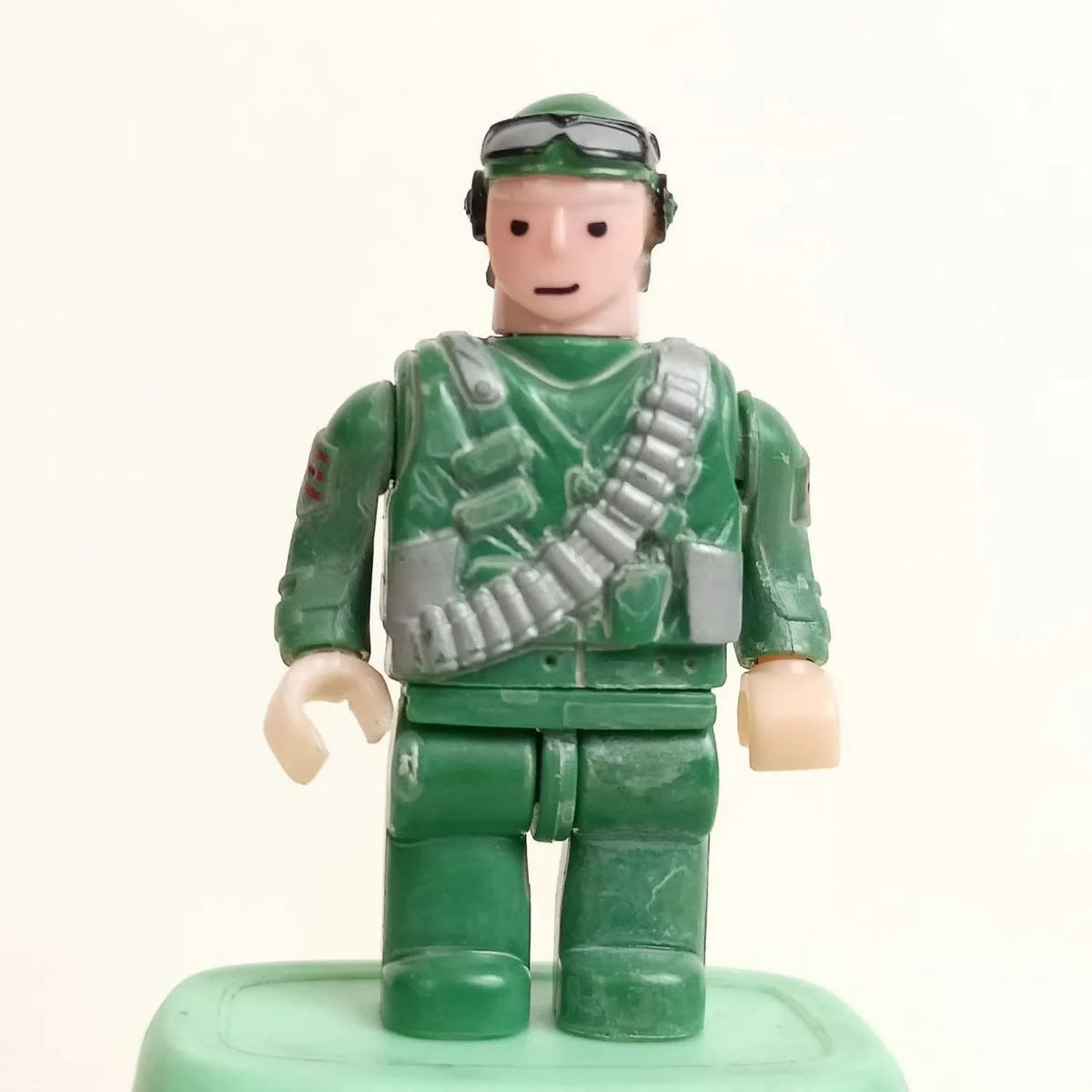 Soldier, green suit with gray dirt & tactical helmet with goggles