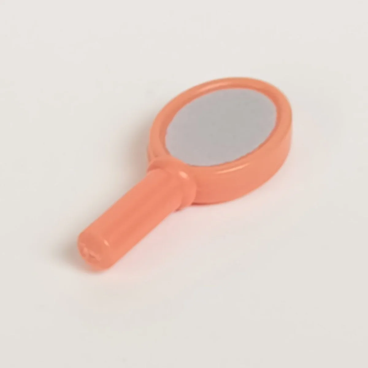 handheld mirror with metallic silver mirror pattern