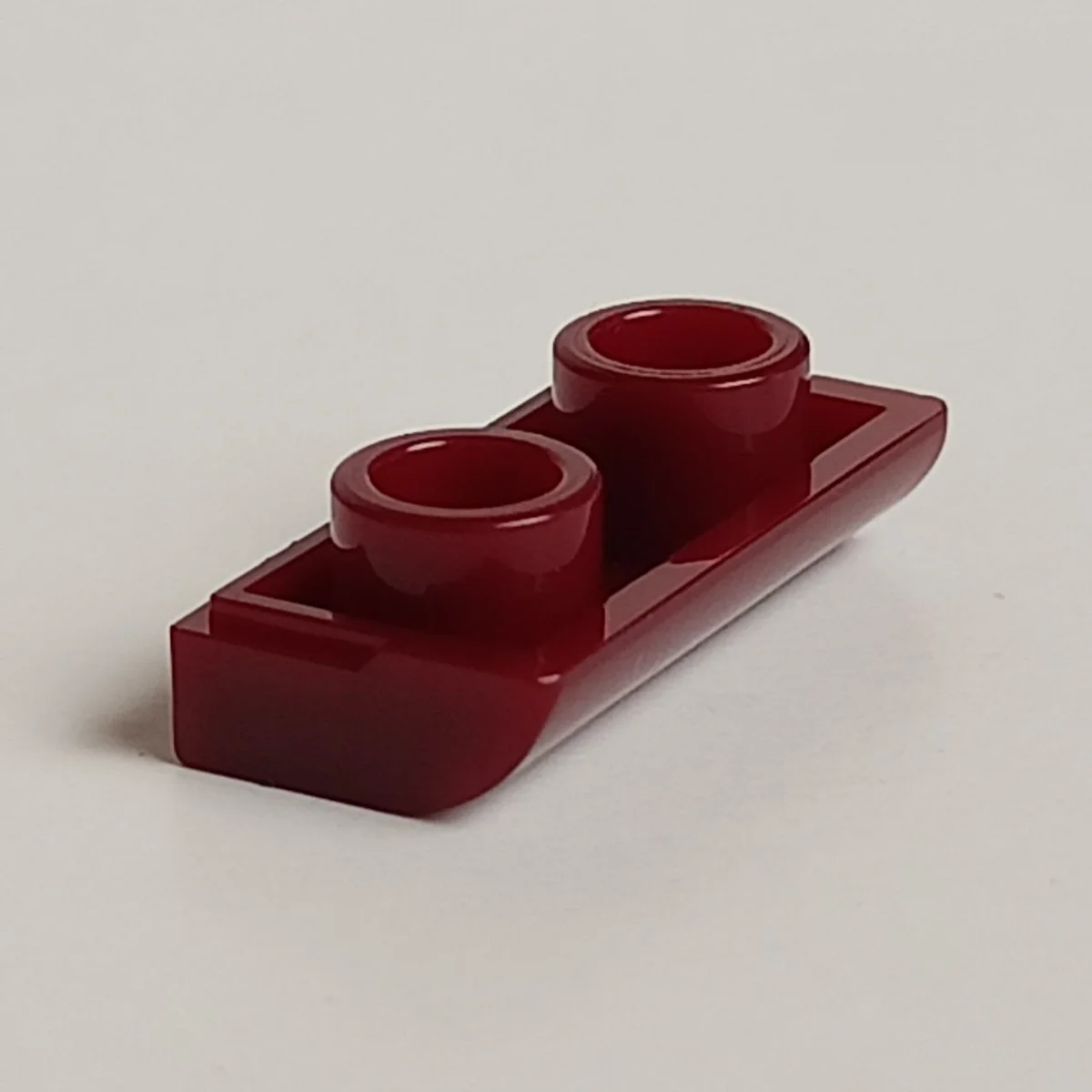 Tile 1 x 2 inverse with curved lip lengthwise in Red, Falu