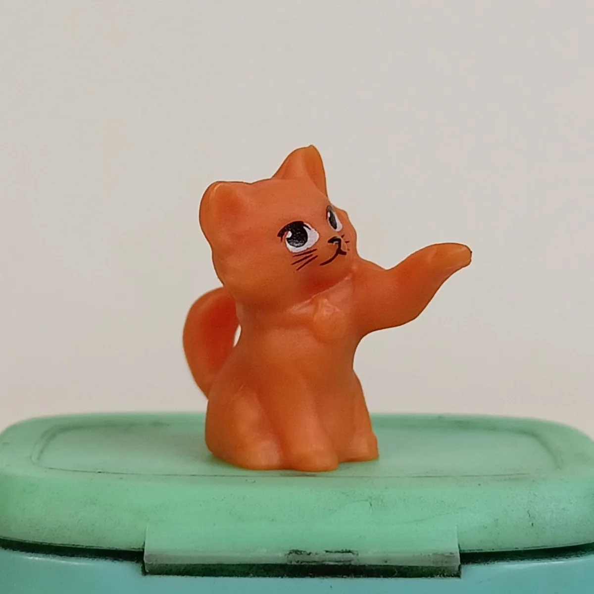 Kitten, left paw up (light orange fur)