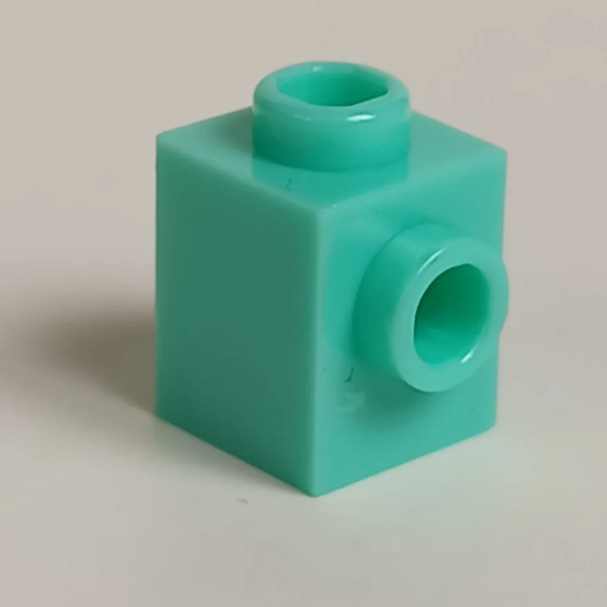 Brick Modified 1 x 1 with side stud in Teal