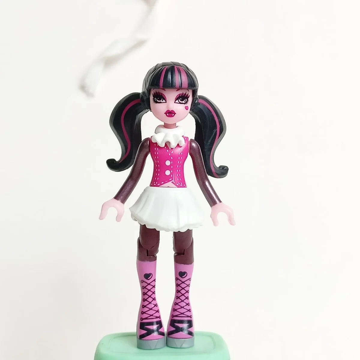 Draculaura, white skirt, barbie pink vest and boots with silver soles