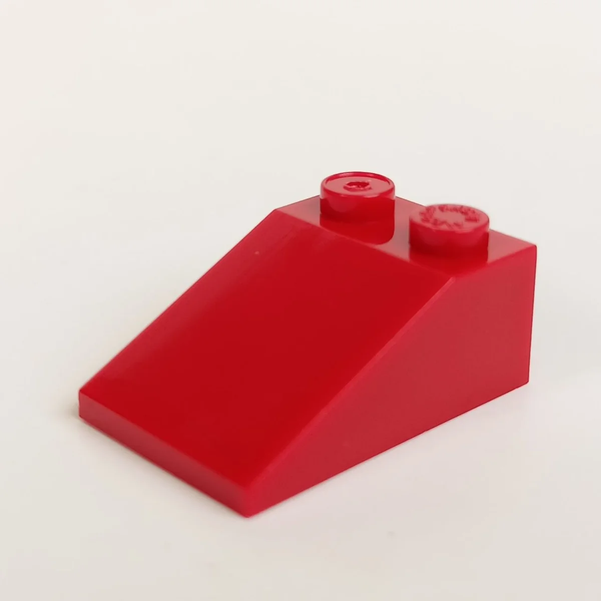 Slope 33 2 x 3 w/ Studs on Top in Red, Flame
