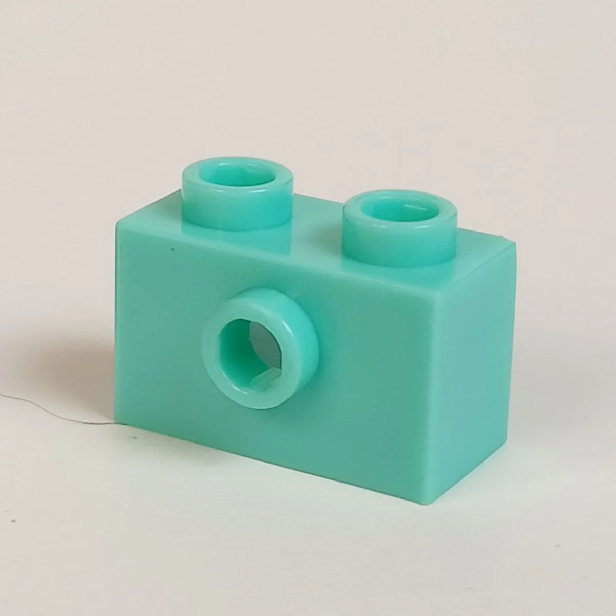 Brick Modified 1 x 2 with side stud in Teal