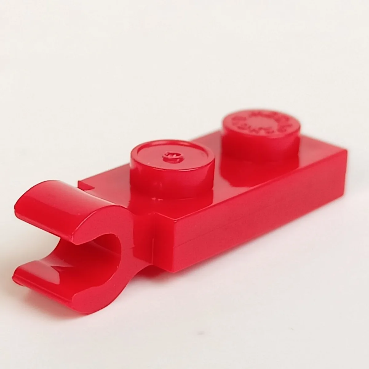 Plate Modified 1 x 2 with horizontal clip in Red, Flame