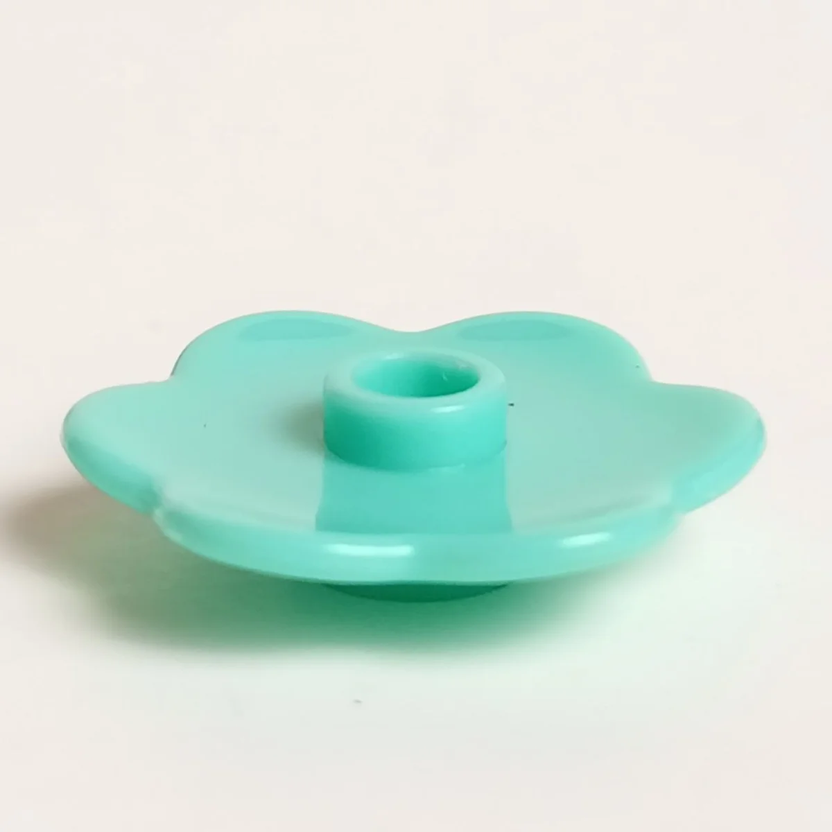 Gear: saucer, flower-shaped in Teal