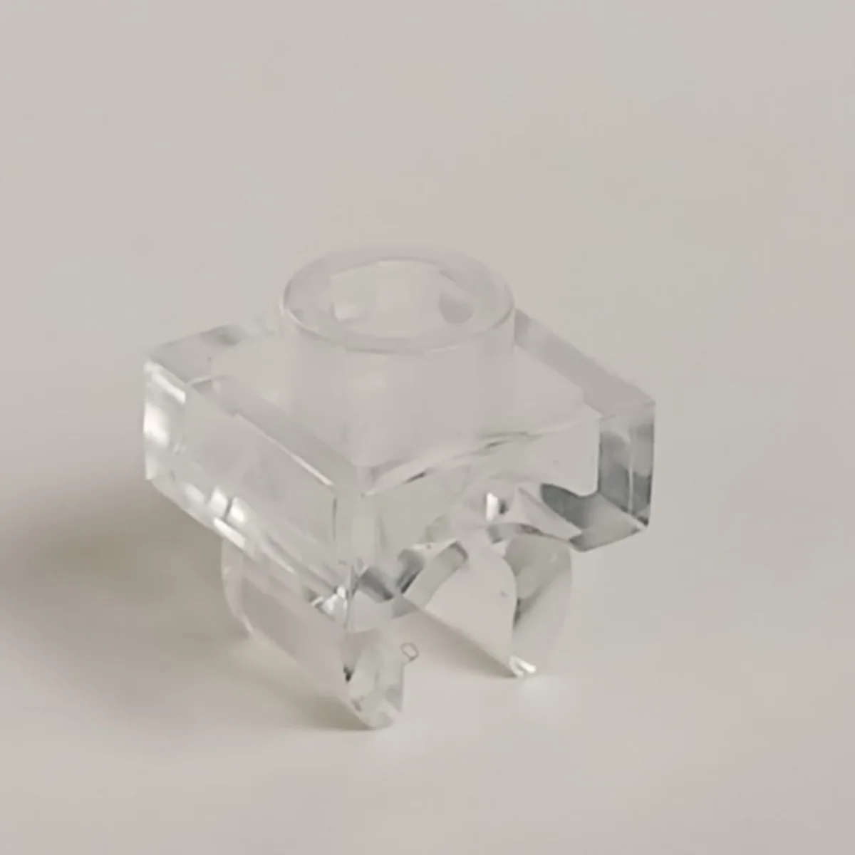 Plate 1 x 1 with underside clip in Clear (Translucent)