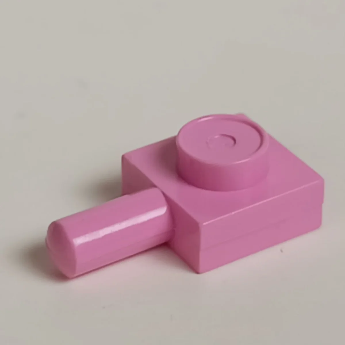Plate Modified 1 x 1 with horizontal pin in Pink, Rose
