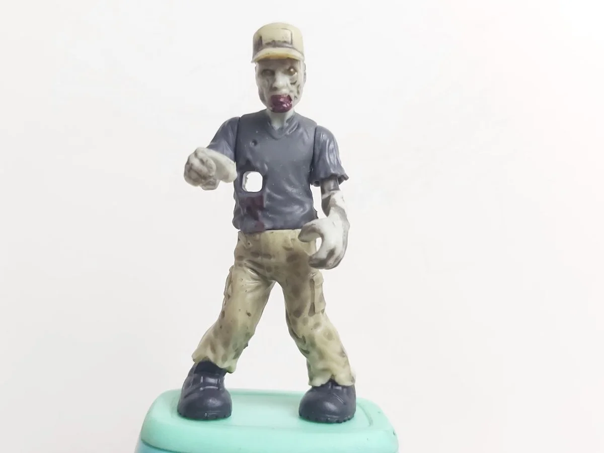 Figure, CoD: zombie, tan pants, black shirt, hole in torso