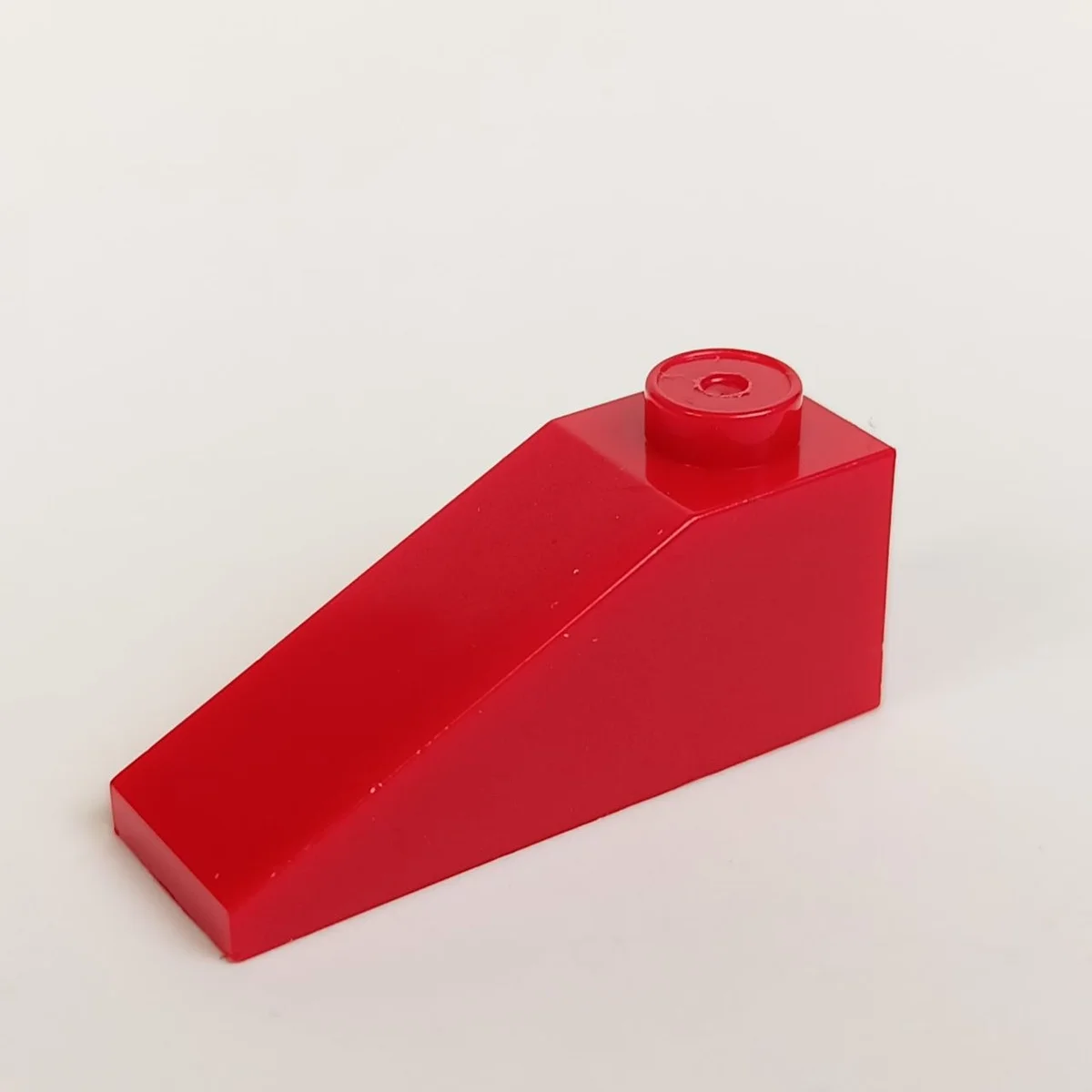 Slope Brick 33 1 x 3 with Stud on Top in Red, Flame